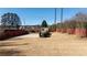 Large backyard shot of cement pad, shed, yard and perimeter fencing at 5289 Browning Sw Way, Lilburn, GA 30047