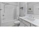 Clean bathroom offers a shower-tub combo with white tile surround and marble countertop vanity at 5930 Brundage Ln, Norcross, GA 30071