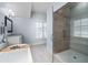 Luxurious bathroom featuring soaking tub, glass shower, and elegant fixtures at 5930 Brundage Ln, Norcross, GA 30071