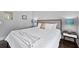 Bedroom featuring hardwood floors, neutral colors and light from a large window at 5930 Brundage Ln, Norcross, GA 30071
