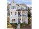 Charming two-story white home with a covered front porch and beautifully landscaped front yard at 5930 Brundage Ln, Norcross, GA 30071