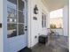 Charming front door with glass paneling, white brick and black hardware at 5930 Brundage Ln, Norcross, GA 30071