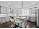 Modern kitchen with gray cabinets, stainless steel appliances, and a granite island with seating at 5930 Brundage Ln, Norcross, GA 30071