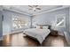 Spacious main bedroom with tray ceiling, hardwood floors, and plenty of natural light at 5930 Brundage Ln, Norcross, GA 30071
