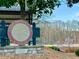 Rossie Brundage Park sign showing park hours and amenities at 5930 Brundage Ln, Norcross, GA 30071