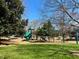 Community playground with colorful slides and a swing set on a sunny day at 5930 Brundage Ln, Norcross, GA 30071