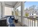 Cozy porch with blue cushioned seating and views of the neighborhood at 5930 Brundage Ln, Norcross, GA 30071