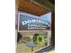 Dominick's Little Italy restaurant sign, reflects the outdoor tables and a decorative wreath at 5930 Brundage Ln, Norcross, GA 30071
