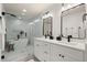 Luxurious bathroom featuring a glass-enclosed shower, soaking tub, and dual vanities at 6405 Cherry Tree Ln, Atlanta, GA 30328