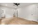 Spacious bedroom with hardwood floors and multiple doorways at 6405 Cherry Tree Ln, Atlanta, GA 30328