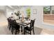Bright dining room with hardwood floors, an ample table, and multiple windows that bring the outside in at 6405 Cherry Tree Ln, Atlanta, GA 30328