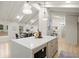 Open-concept kitchen featuring a large quartz island, custom cabinetry, and hardwood floors at 6405 Cherry Tree Ln, Atlanta, GA 30328