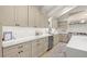 Contemporary kitchen with light cabinets, quartz counters, stainless steel appliances, and hardwood floors at 6405 Cherry Tree Ln, Atlanta, GA 30328