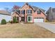 Charming brick home with manicured lawn, two-car garage, and inviting front entrance at 1264 Ridge Vista Nw Ct, Lawrenceville, GA 30043