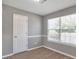 Cozy bedroom with hard floors, a large window, and fresh paint at 1321 Stoneleigh Dr, Conyers, GA 30094