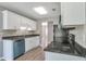 Kitchen featuring stainless steel appliances, white cabinets, and modern countertops at 1321 Stoneleigh Dr, Conyers, GA 30094