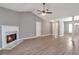 Living room featuring fireplace, hard floors, vaulted ceiling and large columns at 1321 Stoneleigh Dr, Conyers, GA 30094