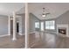 Bright living room featuring modern floors, a fireplace, and ample natural light at 1321 Stoneleigh Dr, Conyers, GA 30094