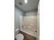 Clean bathroom features a shower-tub combo with bright white tiling at 1496 Brentwood Dr, Marietta, GA 30062