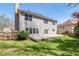 Back of home featuring a well-maintained lawn, concrete patio, and privacy fence at 2848 Stockbridge Way, Dacula, GA 30019