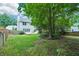 Expansive backyard featuring lush green lawn, trees, and privacy fencing perfect for outdoor activities at 2848 Stockbridge Way, Dacula, GA 30019
