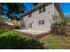 View of backyard showing grass, foliage, and exterior of home at 2848 Stockbridge Way, Dacula, GA 30019