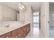 Full bathroom featuring double vanity, a large mirror and separate areas for the shower and toilet at 2848 Stockbridge Way, Dacula, GA 30019
