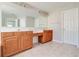 Bathroom features a large mirror, double sink vanity with storage and a neutral color palette at 2848 Stockbridge Way, Dacula, GA 30019