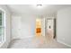 Bedroom with neutral color walls and view of bathroom through the opened door at 2848 Stockbridge Way, Dacula, GA 30019