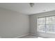 Well-lit room with a large window, plush carpet, and neutral colored walls at 2848 Stockbridge Way, Dacula, GA 30019