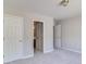 Spacious carpeted bedroom with neutral walls and a bathroom and closet access at 2848 Stockbridge Way, Dacula, GA 30019