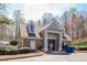 View of a community clubhouse with stone and light blue vinyl siding at 2848 Stockbridge Way, Dacula, GA 30019