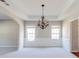 Bright dining room featuring tray ceiling, recessed lighting and natural light at 2848 Stockbridge Way, Dacula, GA 30019