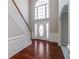 Bright foyer with hardwood floors and a staircase leading to the second floor at 2848 Stockbridge Way, Dacula, GA 30019