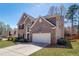 Beautiful brick home featuring a two-car garage and landscaped front yard at 2848 Stockbridge Way, Dacula, GA 30019