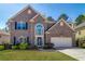 Charming two-story brick home with a well-manicured lawn and inviting curb appeal at 2848 Stockbridge Way, Dacula, GA 30019