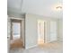 Bright hallway featuring neutral paint, carpet flooring, and multiple doorways leading to other rooms at 2848 Stockbridge Way, Dacula, GA 30019