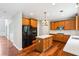 Spacious kitchen featuring stainless steel appliances, a center island, and hardwood floors at 2848 Stockbridge Way, Dacula, GA 30019