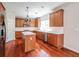 Well-equipped kitchen featuring wood cabinets, stainless steel appliances, and a center island at 2848 Stockbridge Way, Dacula, GA 30019