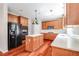 Spacious kitchen equipped with wood cabinets, stainless steel appliances, and a functional center island at 2848 Stockbridge Way, Dacula, GA 30019