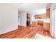 Open kitchen with hardwood floors, stainless appliances, wooden cabinets, and center island at 2848 Stockbridge Way, Dacula, GA 30019