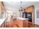 Open kitchen featuring stainless appliances, white countertops, and sightlines to the living room at 2848 Stockbridge Way, Dacula, GA 30019