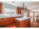 Kitchen showcasing a central island, modern appliances, and a view of the sunlit backyard at 2848 Stockbridge Way, Dacula, GA 30019