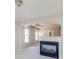 Bright living room with a fireplace, decorative archways, carpet and an open floorplan at 2848 Stockbridge Way, Dacula, GA 30019