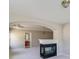 Living room with an open plan, decorative archways, fireplace, and entry to the ensuite bath at 2848 Stockbridge Way, Dacula, GA 30019