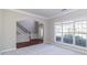 Inviting living room with large windows and a view of the staircase and front door at 2848 Stockbridge Way, Dacula, GA 30019