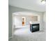 Bright living room featuring a fireplace with an archway to another room at 2848 Stockbridge Way, Dacula, GA 30019