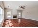 Spacious living room features a fireplace, lots of natural light, and hardwood floors at 2848 Stockbridge Way, Dacula, GA 30019