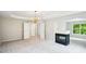 Bright main bedroom featuring a fireplace, chandelier, and multiple closets at 2848 Stockbridge Way, Dacula, GA 30019