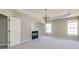 Main bedroom features carpet, a fireplace, natural light, and an entrance to the ensuite bath at 2848 Stockbridge Way, Dacula, GA 30019